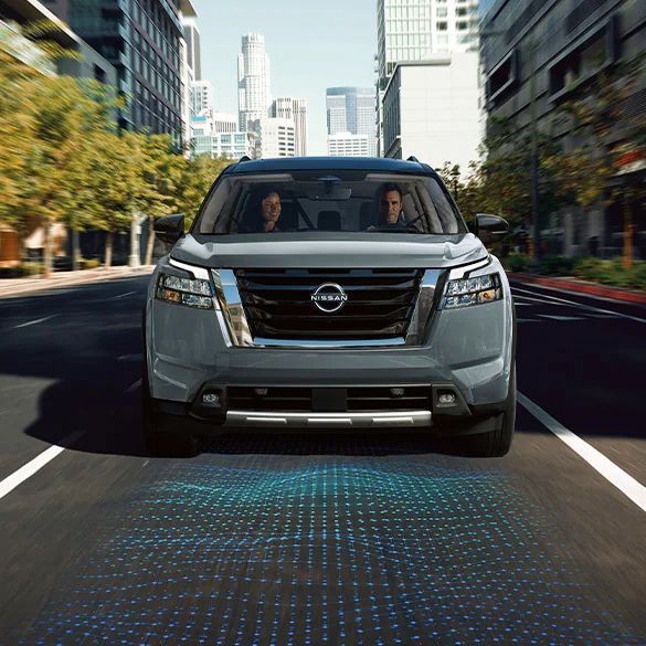 Nissan-SUV-showing-the-ADAS-underneath-it-on-the-street-for-Nissan-Certified-Collision-Center-in-Newport-News-VA