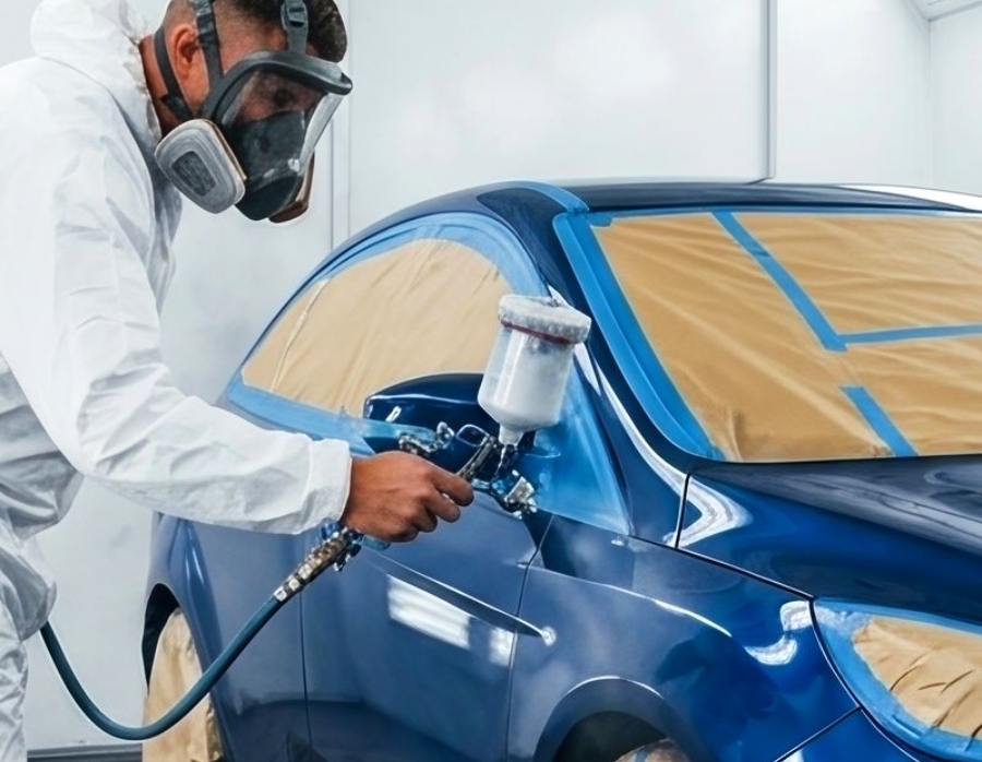 Auto Body Shop tech spraying car Auto Body Shop tech spraying car