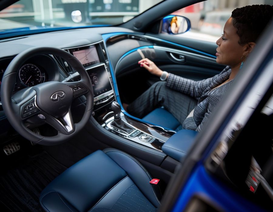 woman in an-infiniti-q after Infiniti Certified Repair New Beginnings Collision Center Happy-Customer-with-Ford-New-Beginnings-Collision-Center