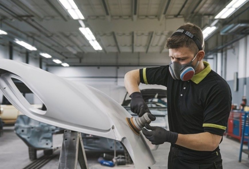 Bumper Repair tech sanding Bumper Repair tech sanding