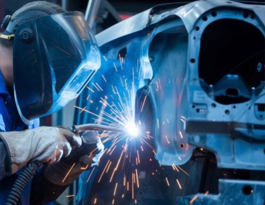 Auto Body Shop tech welding panel